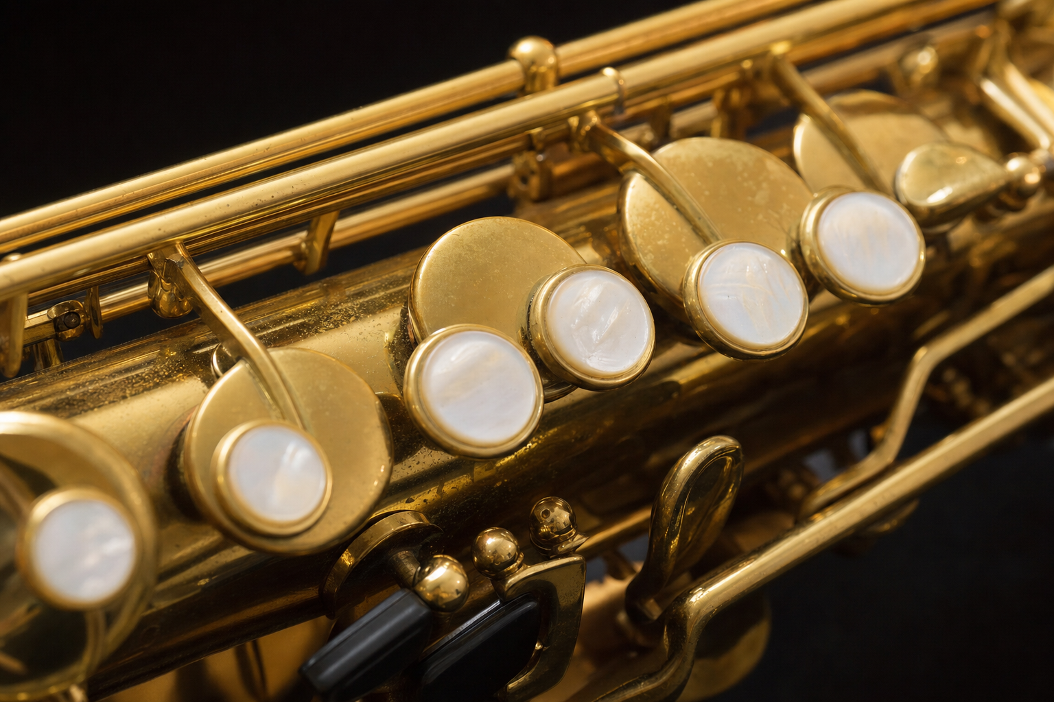 Close-up of the key work on the body of a saxophone