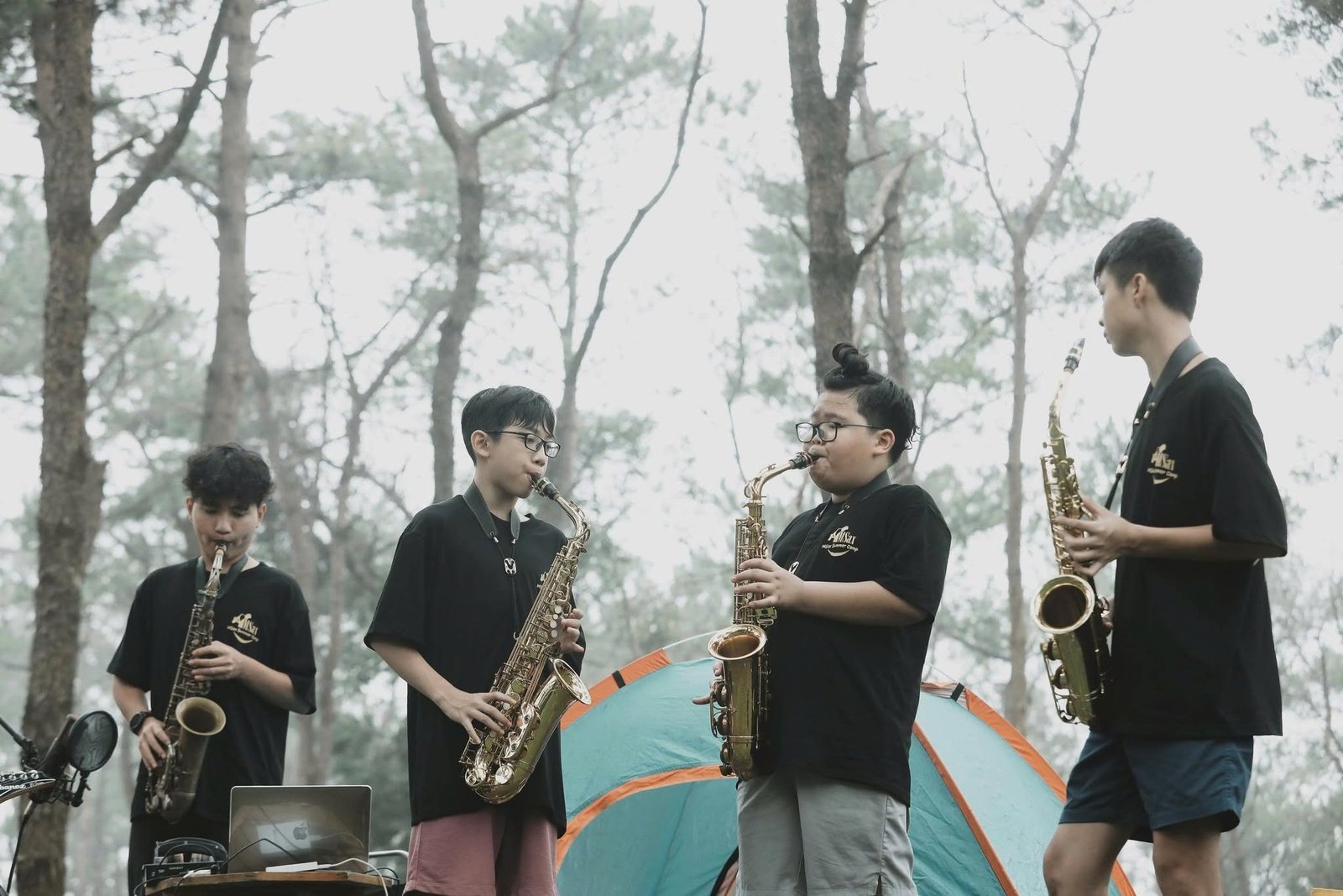 A group of saxophone students taking part in an outdoor activity with a connected, community atmosphere